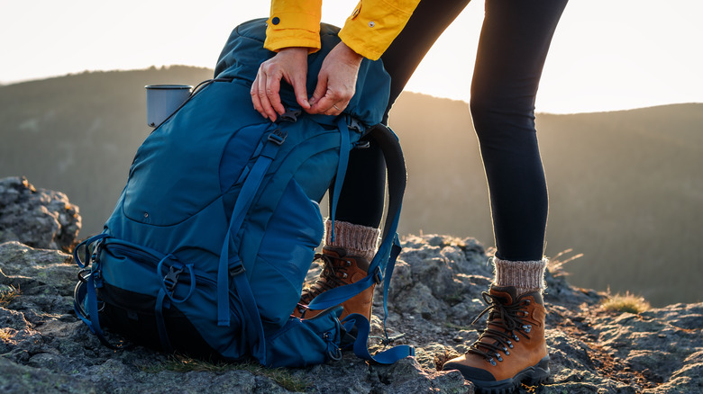 Hiker opening their backpack