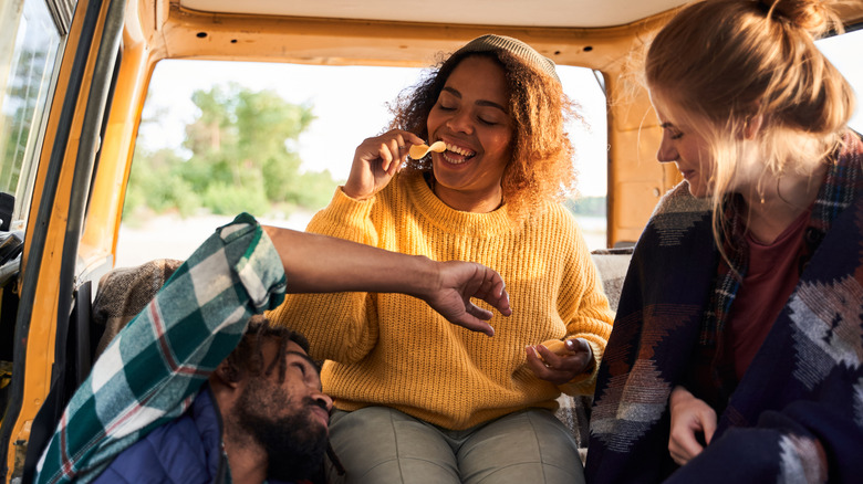 van campers eating chips 