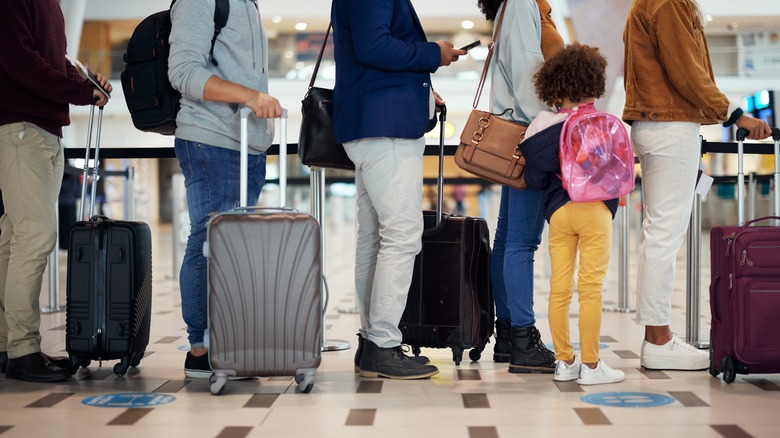 People waiting in line at airport