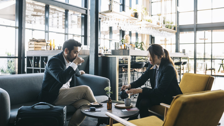 Two business people in lounge