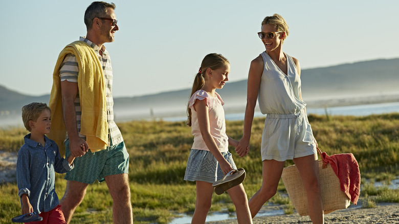 family walking near beach