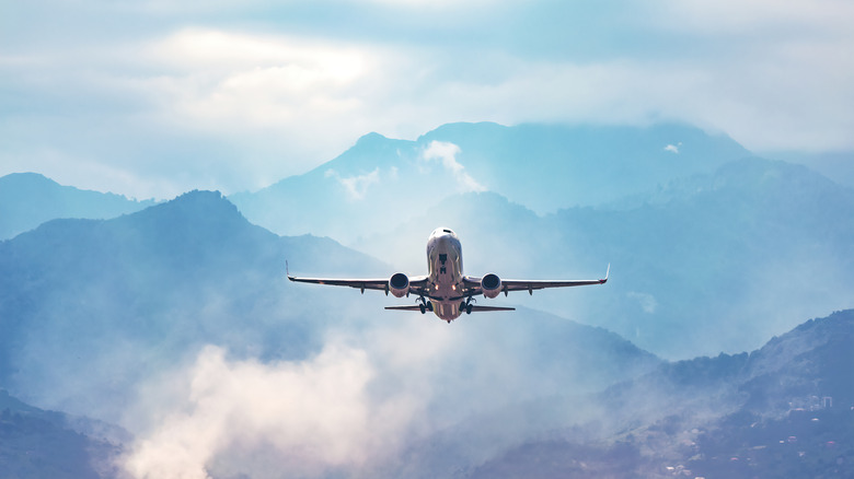 plane traveling over mountains