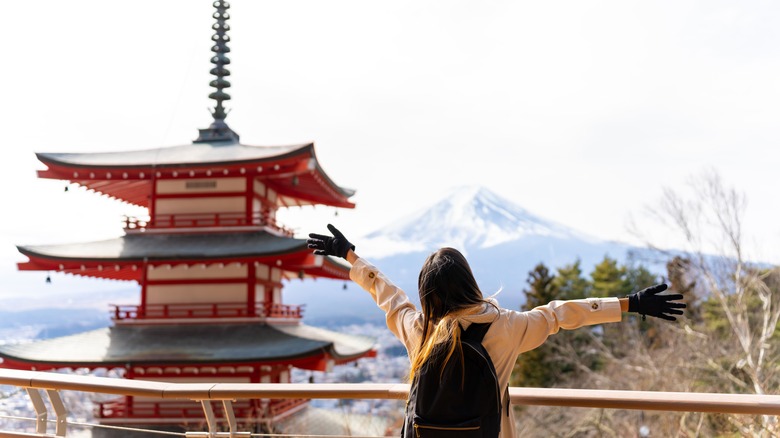 woman visiting Japanese landmark
