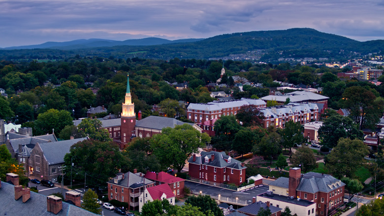 Aerial view of Charlottesville, Virginia and mountain background.