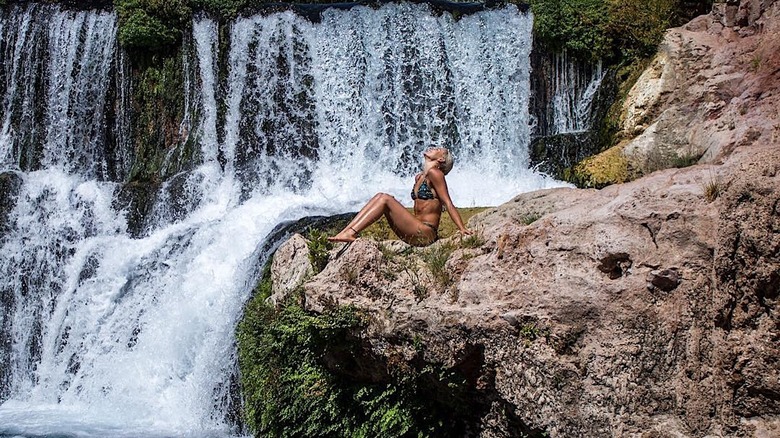 woman in bliss near falls