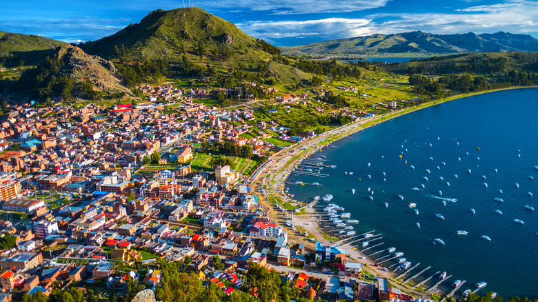 colorful city, hills, and lake