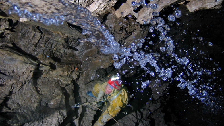 Speleologist exploring Krubera Cave