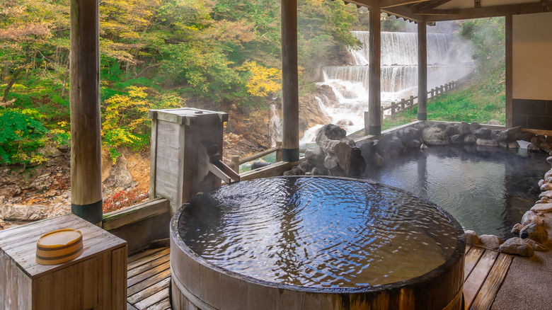 onsen with view waterfall and forest