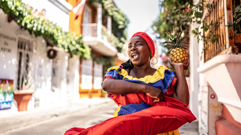 Colombian woman dancing in street