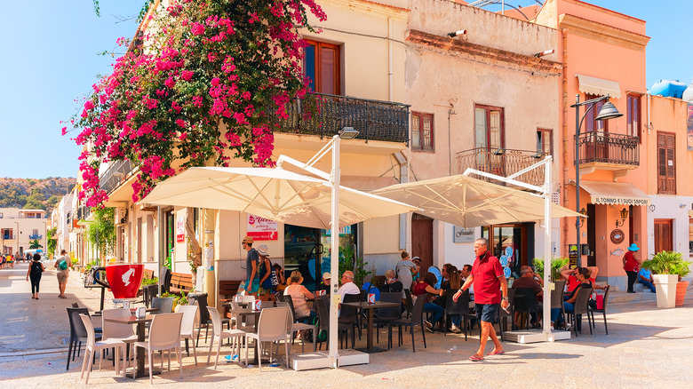 People sit in sidewalk cafe