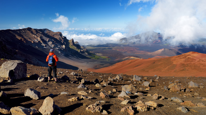 Hiker standing at the crater of a volcano in Haleakala National Park