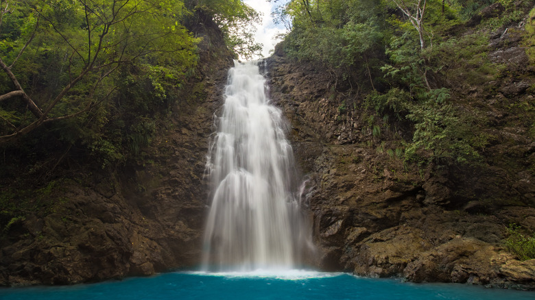 waterfall cascading into pool