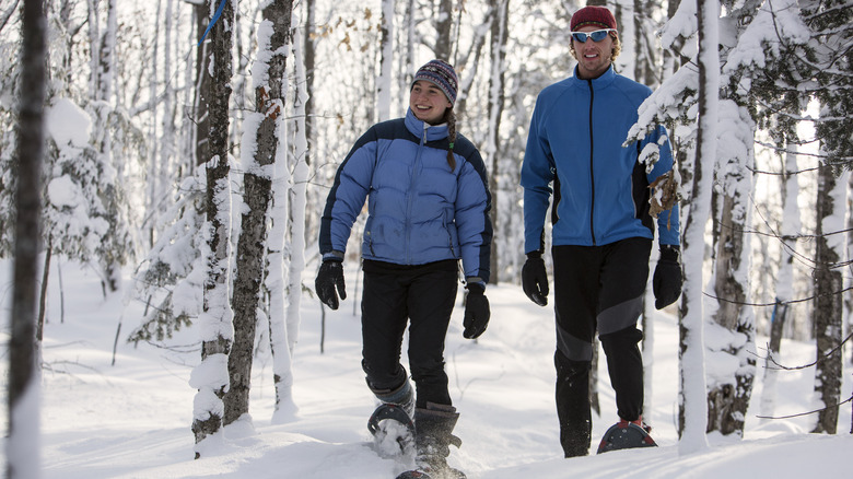 Couple snowshoeing in winter