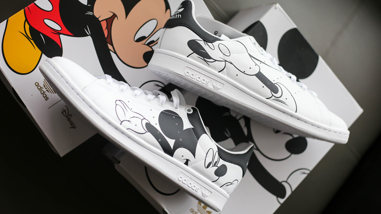 A pair of white Disney sneakers