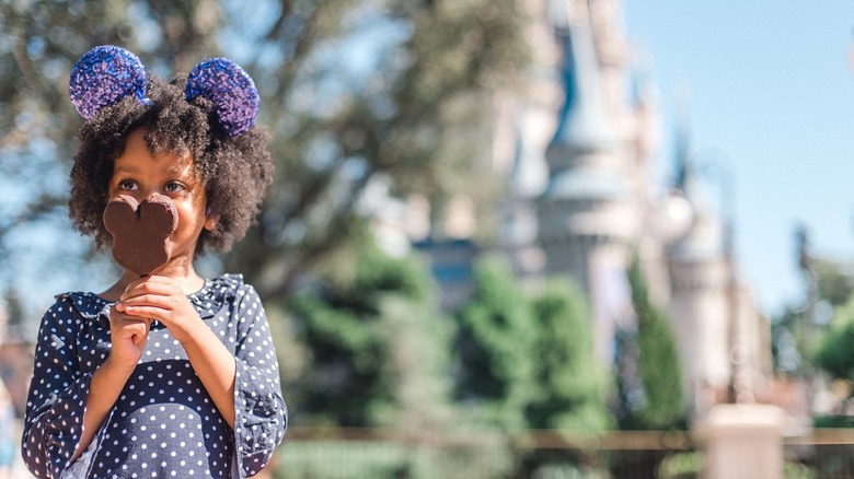 Girl with Disney ears and chocolate