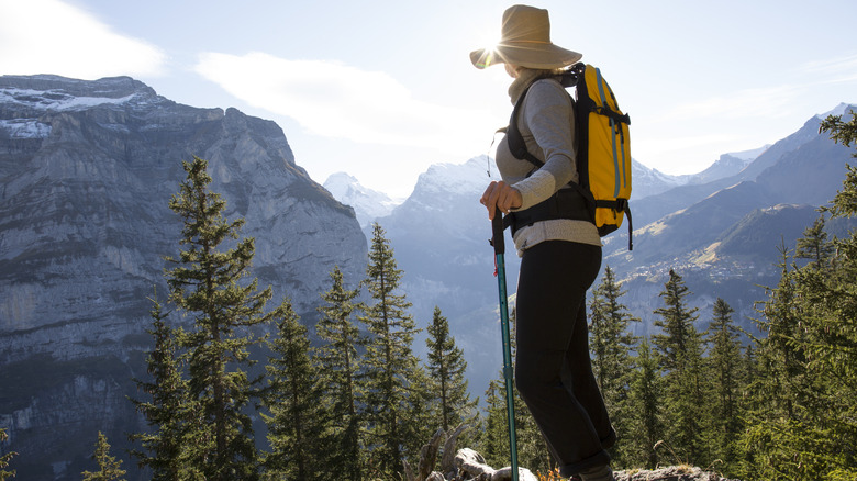 hiker in long pants and hat