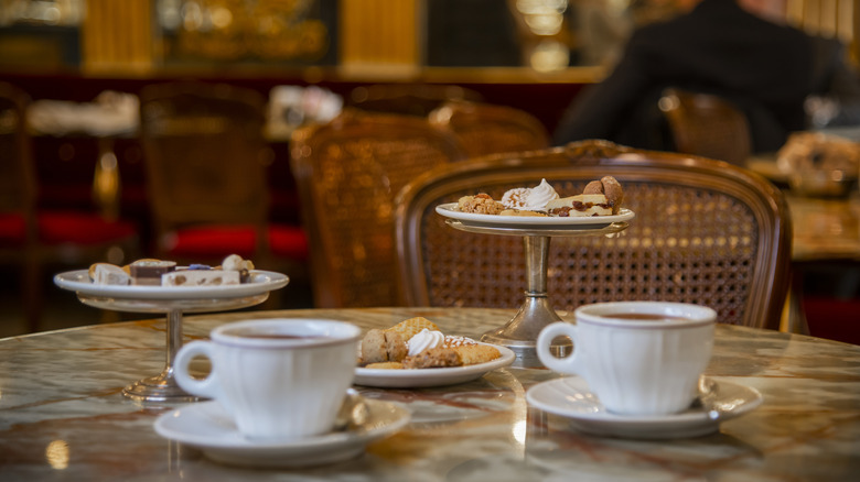 Hot chocolate at a cafe with pastries and treats