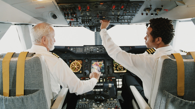 Two pilots in plane cockpit