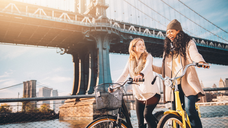 two women riding bikes in NYC