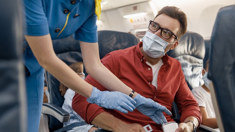 Man sitting in airplane