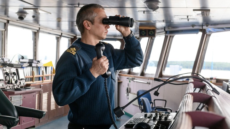 Deck officer with binoculars