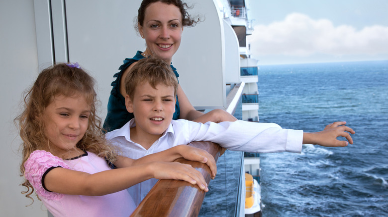 Woman and children on cruise veranda