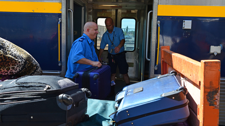 Suitcases being loaded onto train