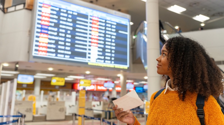 Traveler looking at flight departures