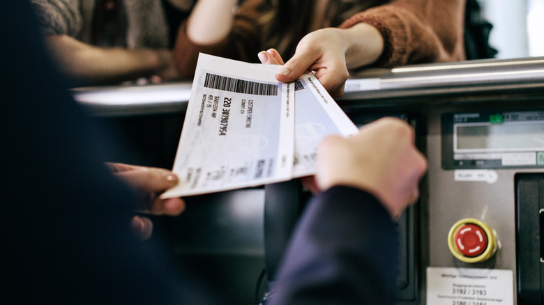 Travelers holding boarding passes