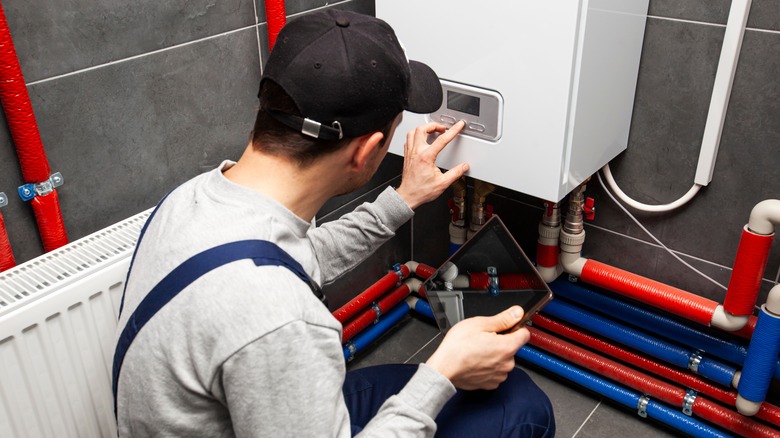 electrician checking heating system