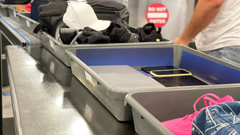 Electronics separated in tray on conveyer belt