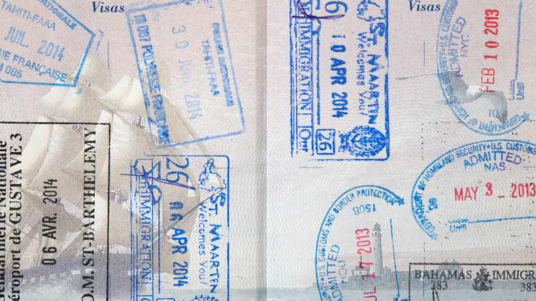 interior of a passport visa pages filled with stamps