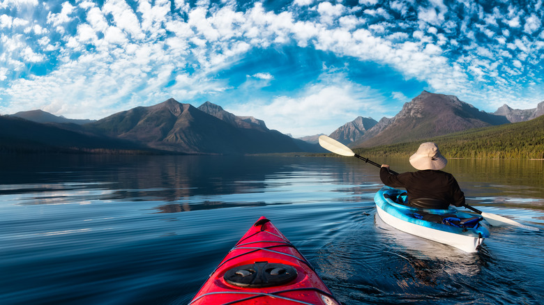 Canoers on lake in Glacier National Park