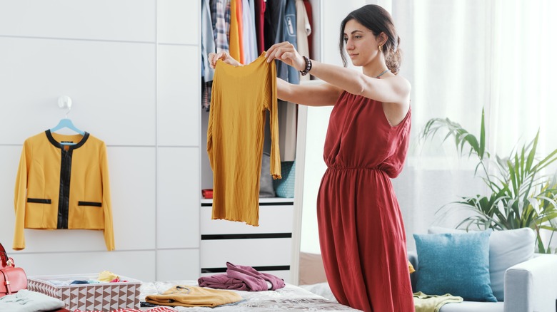 Woman selecting a shirt