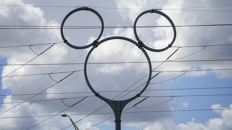 Power lines Mickey Mouse pylon clouds