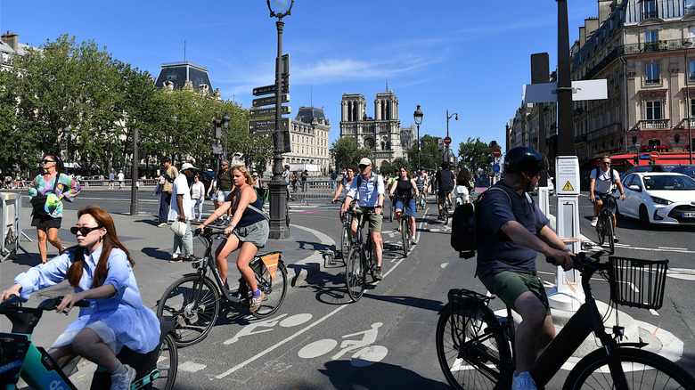 Cyclists on the road in the Latin Quarter of Paris, France