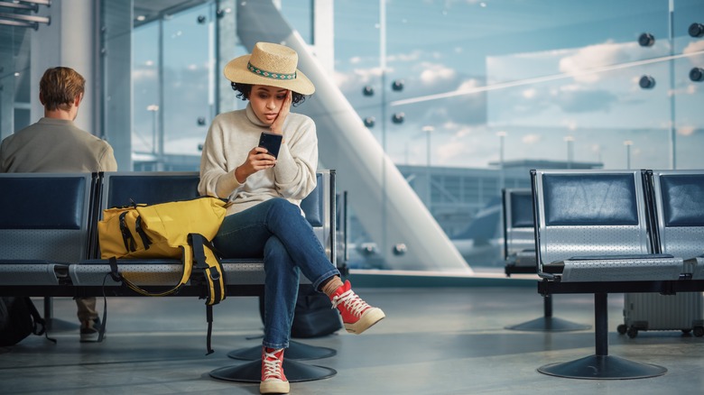 Passenger waiting at airport gate