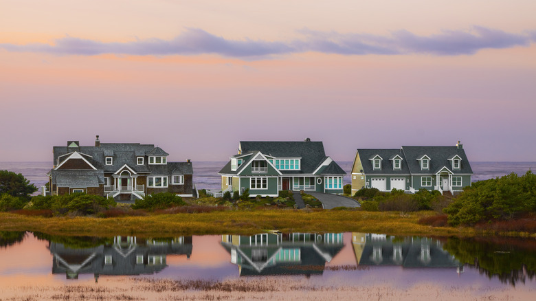 Houses on the beach at sunset