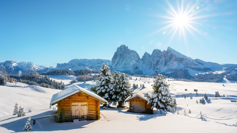 Log cabin in snowy landscape