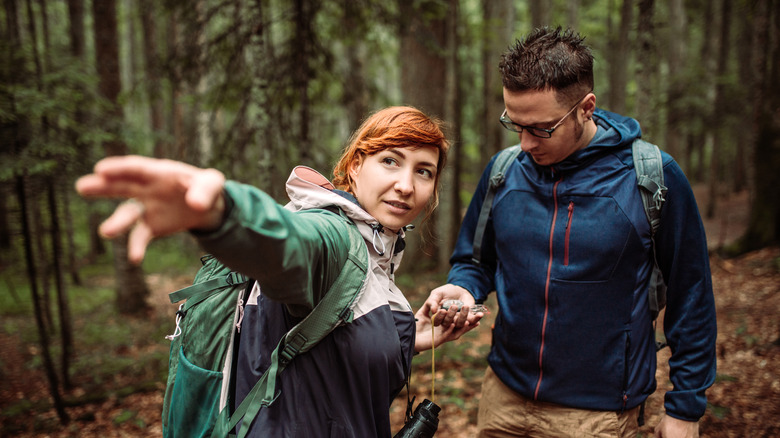 hiking couple discussing plan 