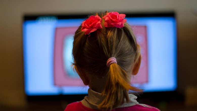 girl in front of TV screen