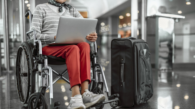 woman in wheelchair on computer