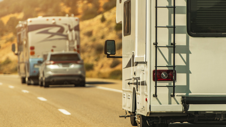 two RVs driving down the freeway