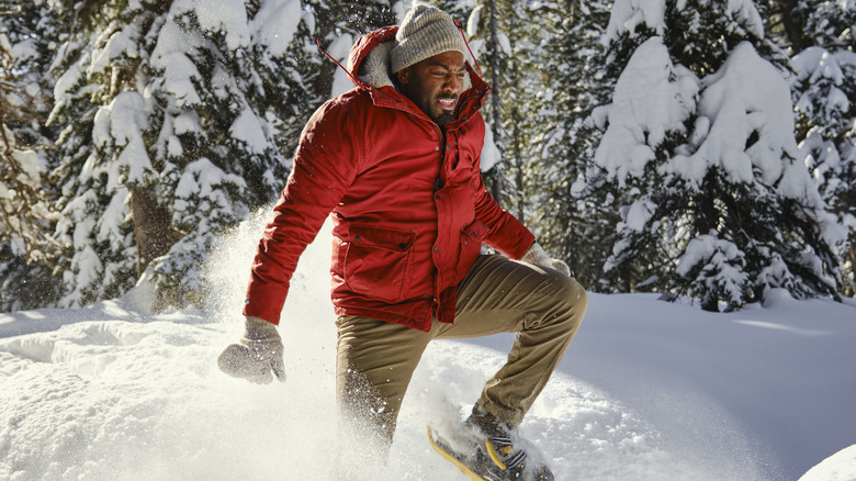 Man snowshoeing in deep snow