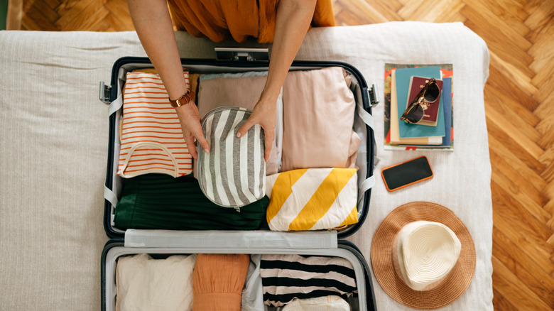 Person packing luggage 