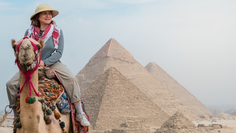 Woman riding camel