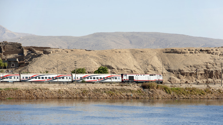 Train moving along the Nile River in Egypt.