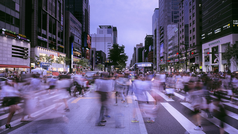 Pedestrians crossing street in Seoul