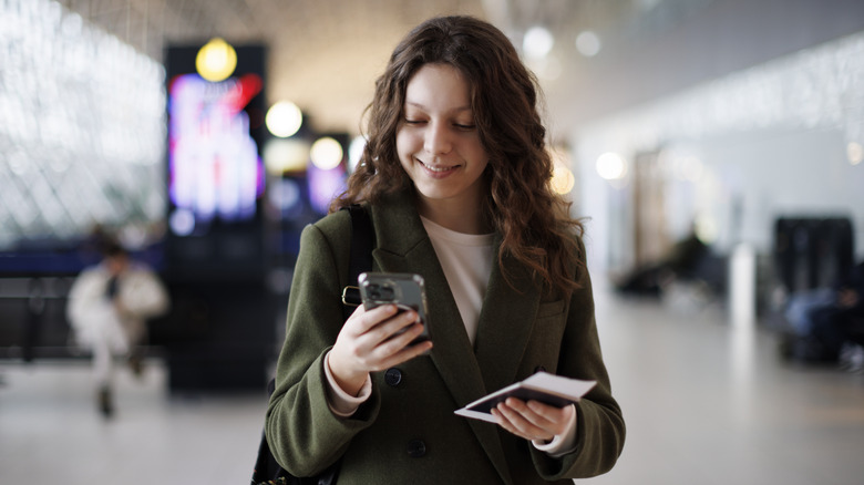 Smiling woman at airport