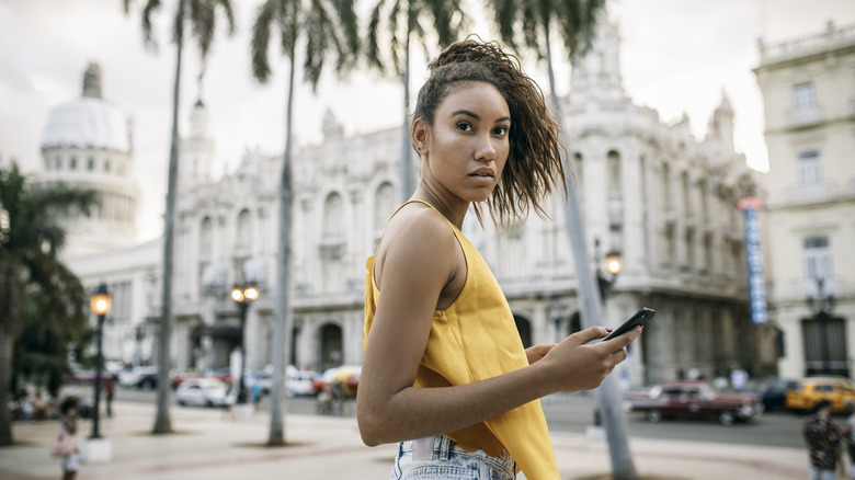 woman using smartphone in Havana